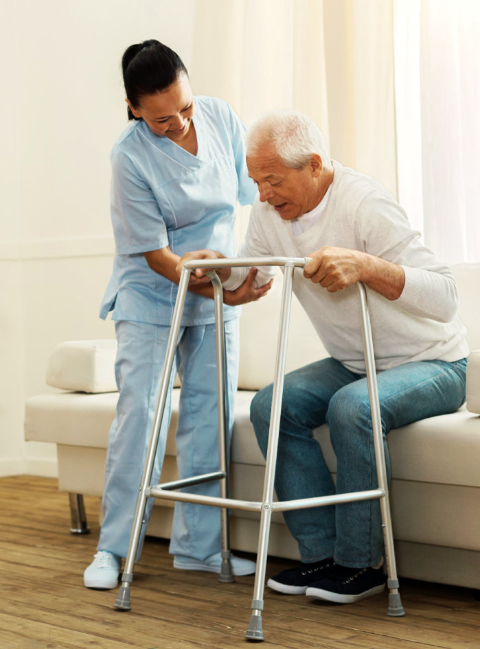 caregiver assisting a senior man