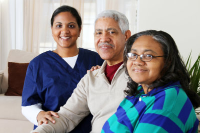 caregiver with seniors smiling