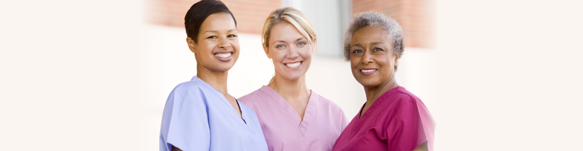 3 nurses smiling